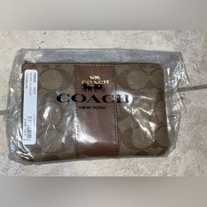 Brand new coach wristlet brown